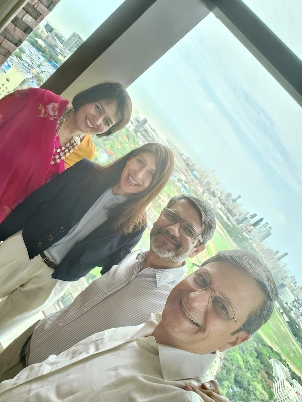 A strategy meeting with a view of Mumbai
